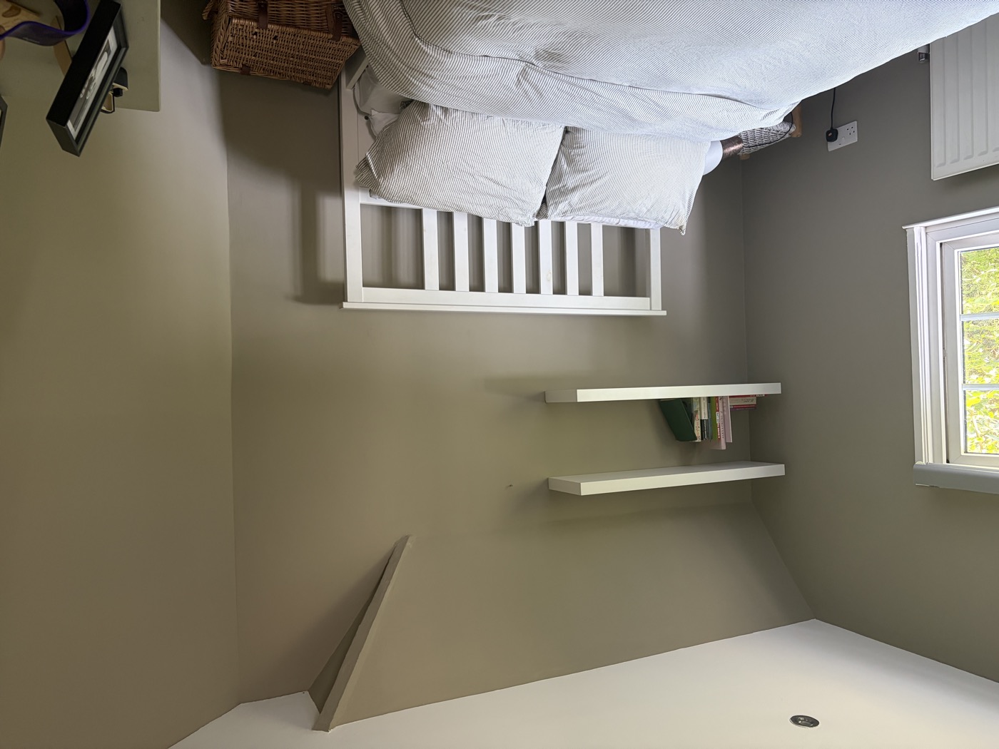 Bedroom with fitted wardrobe — painted walls and woodwork