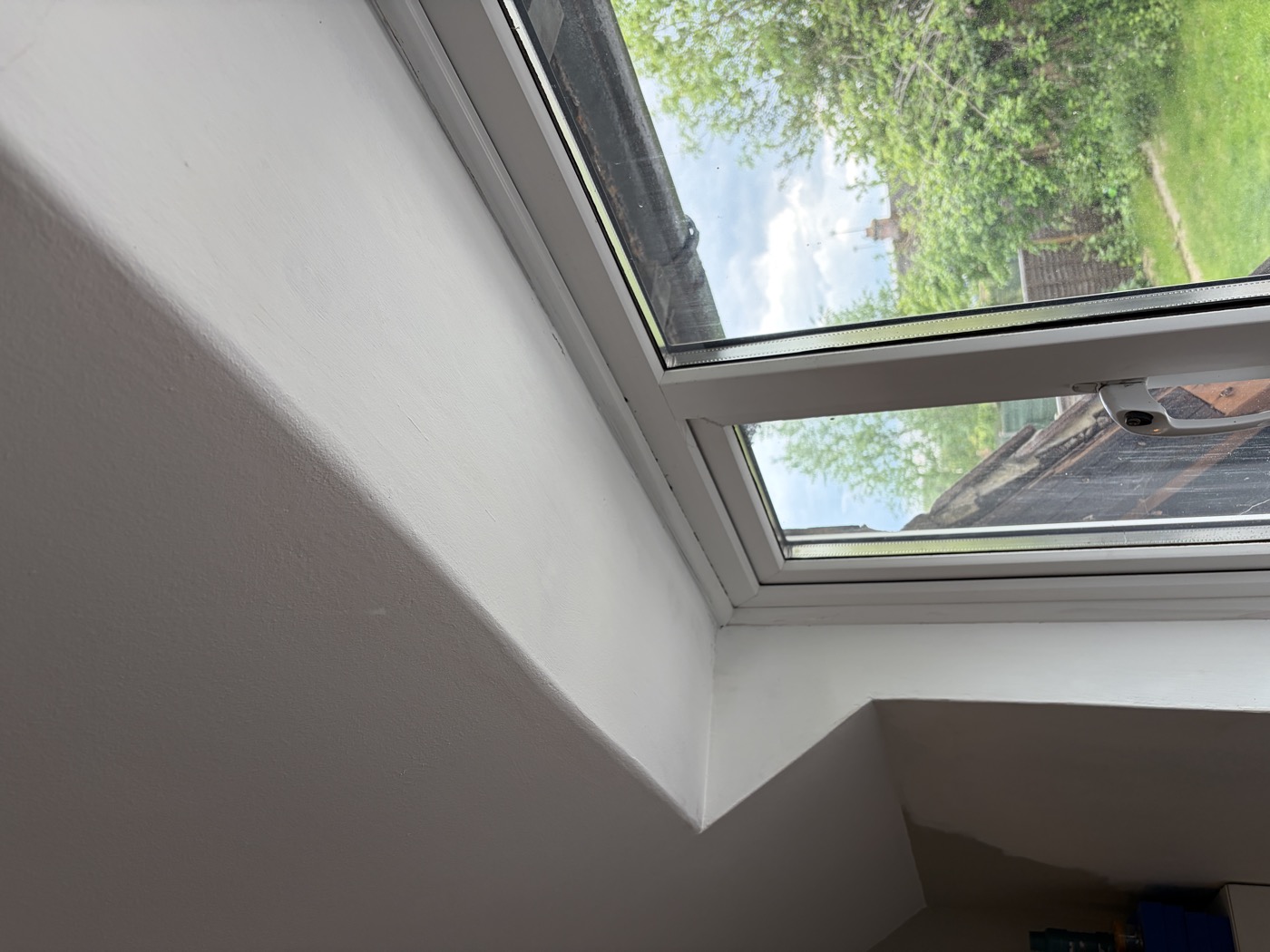 Bedroom window alcove — fresh clean plaster after repair, Velux window