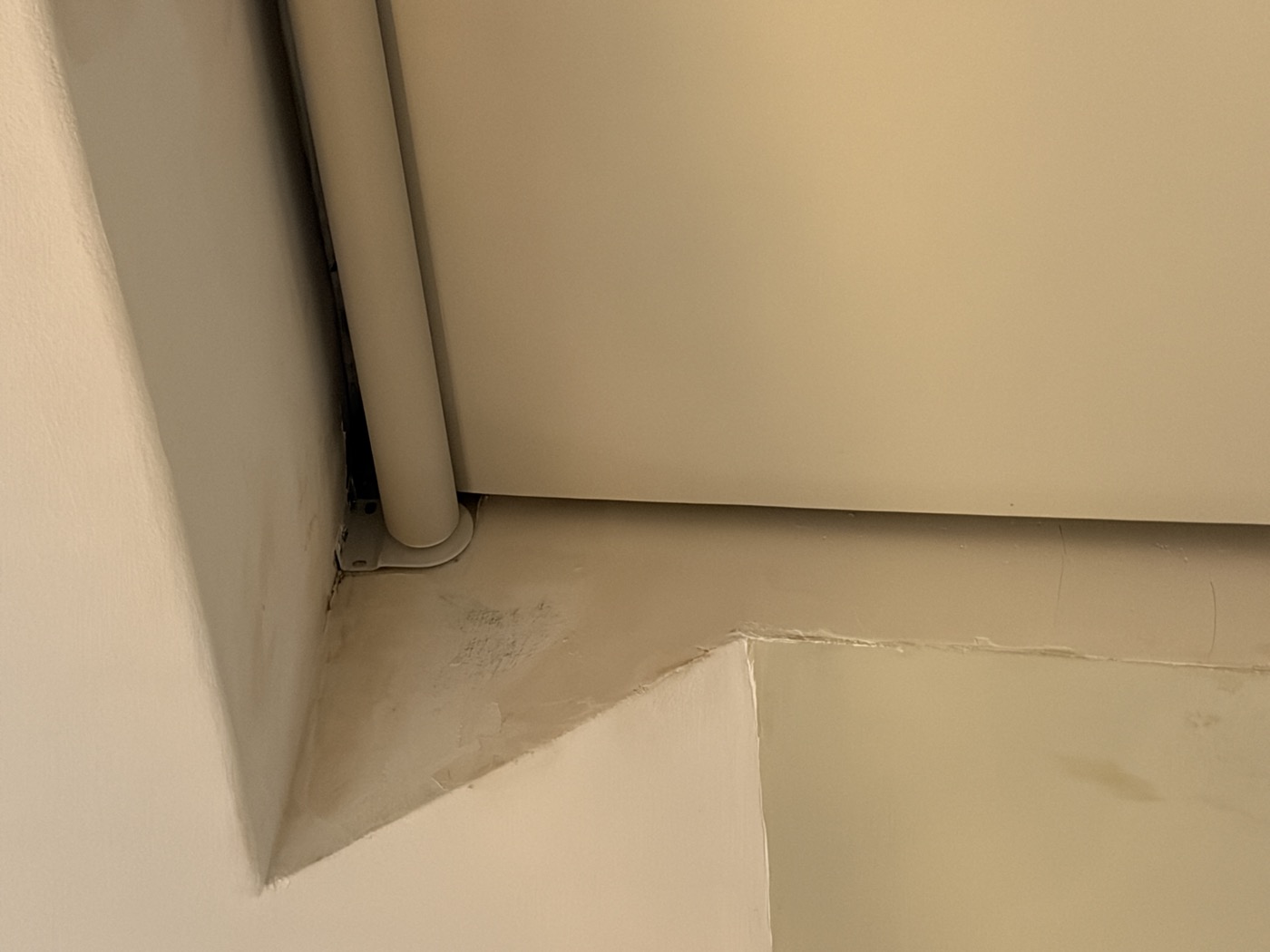 Bedroom window alcove — cracked and lifting plaster before repair